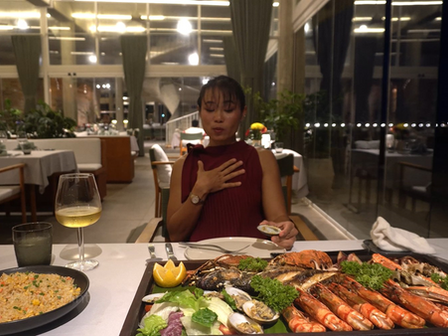 Among the pleasures of a stay at Kep West, dinner at Crab & Co ranks high. Sam Taroth took a seat one evening at the resort's seafront restaurant. Sophy Ouch, Food & Beverage Manager, welcomed her at the table as the house's best-selling dish arrived: a long wooden board of grilled fish and seafood, all landed fresh on the Kep coast.