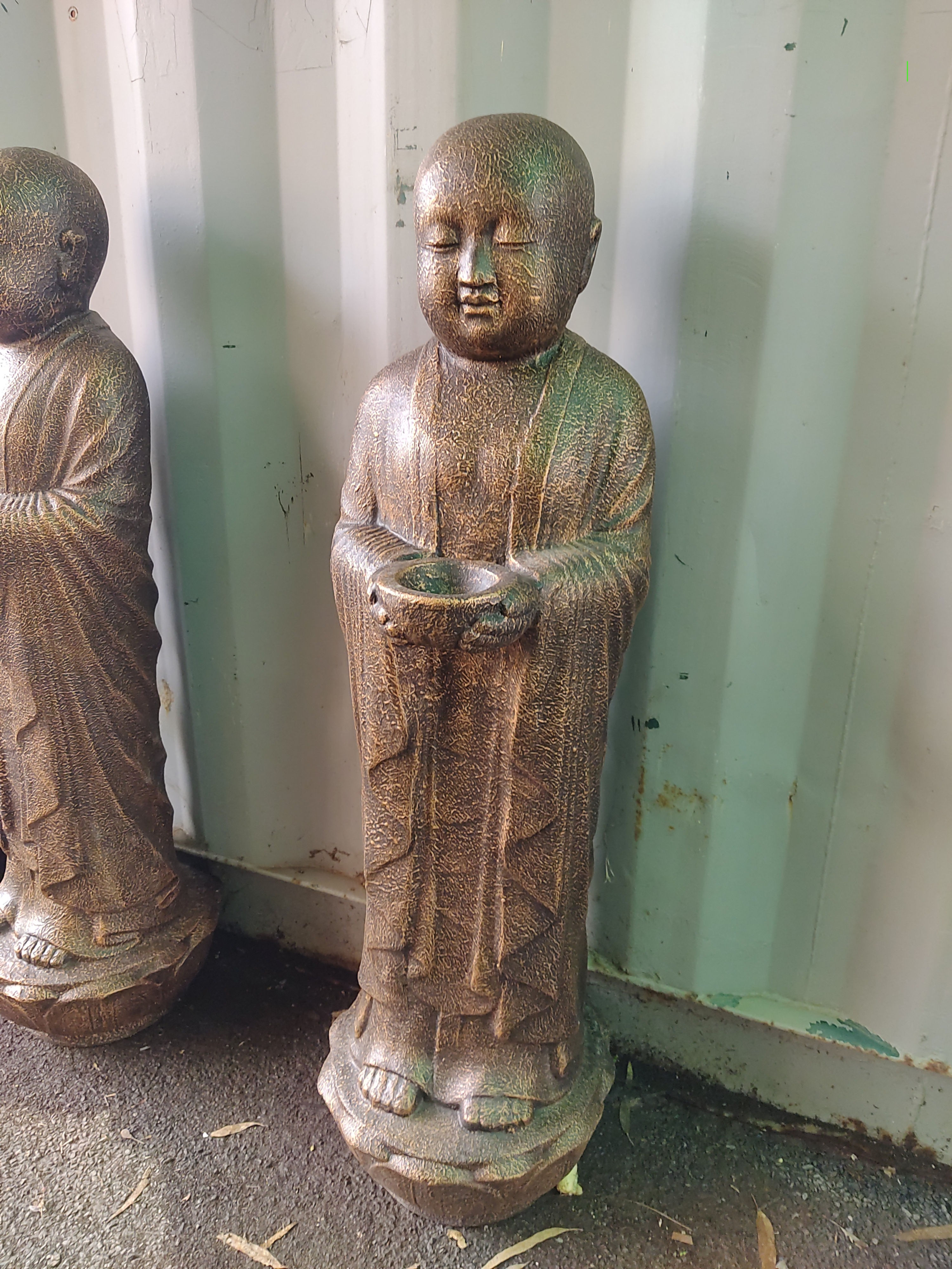 Standing monk with a candle