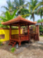 Solid wood hut with terracotta tiles roof