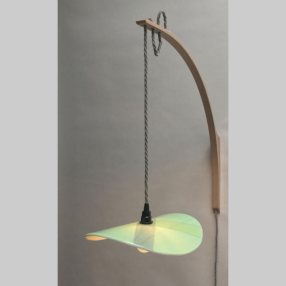 Mint green opaque kiln formed glass wall light, oak & ash arc, angle