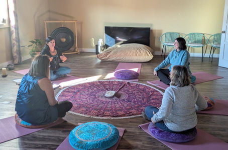 women gathered in circle of connection