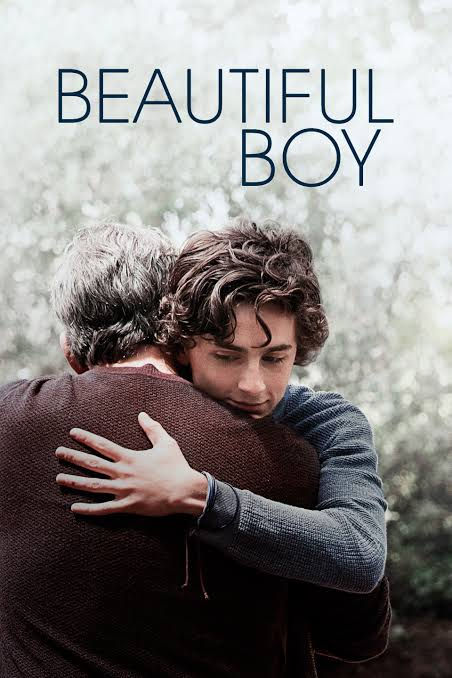 Two people embrace warmly against a blurred background. The word "BEAUTIFUL BOY" is written at the top. The mood is emotional and tender.