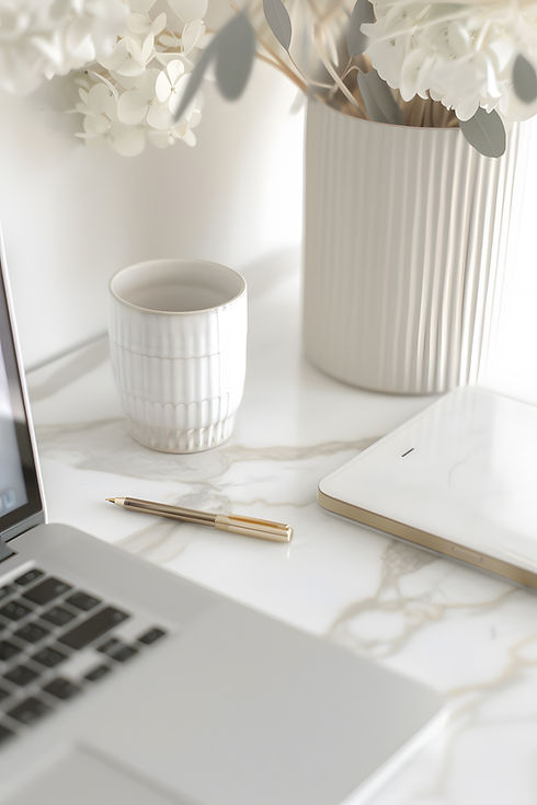 minimalist-workspace-with-laptop-notebook-pen-flowers.jpg