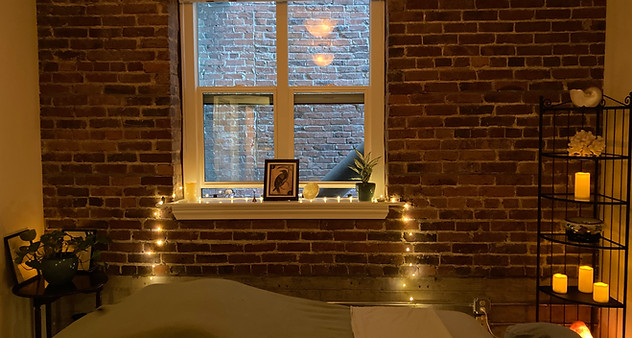 Warm and calming image of Raven Bodywork treatment room
