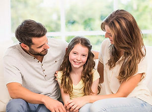 parents-looking-daughter-while-sitting-s