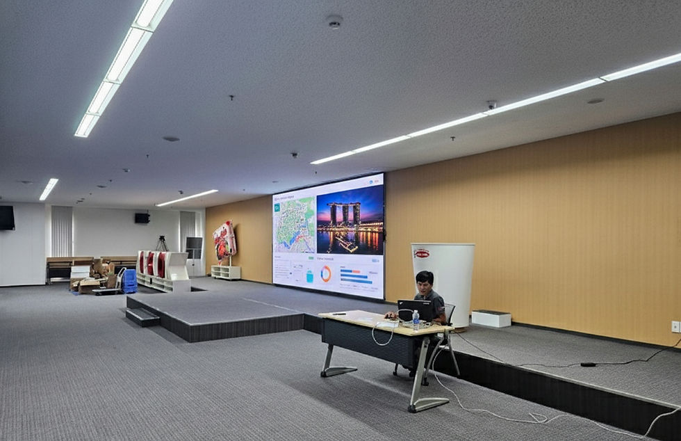 Eye-level view of a large indoor LED video wall in a conference room