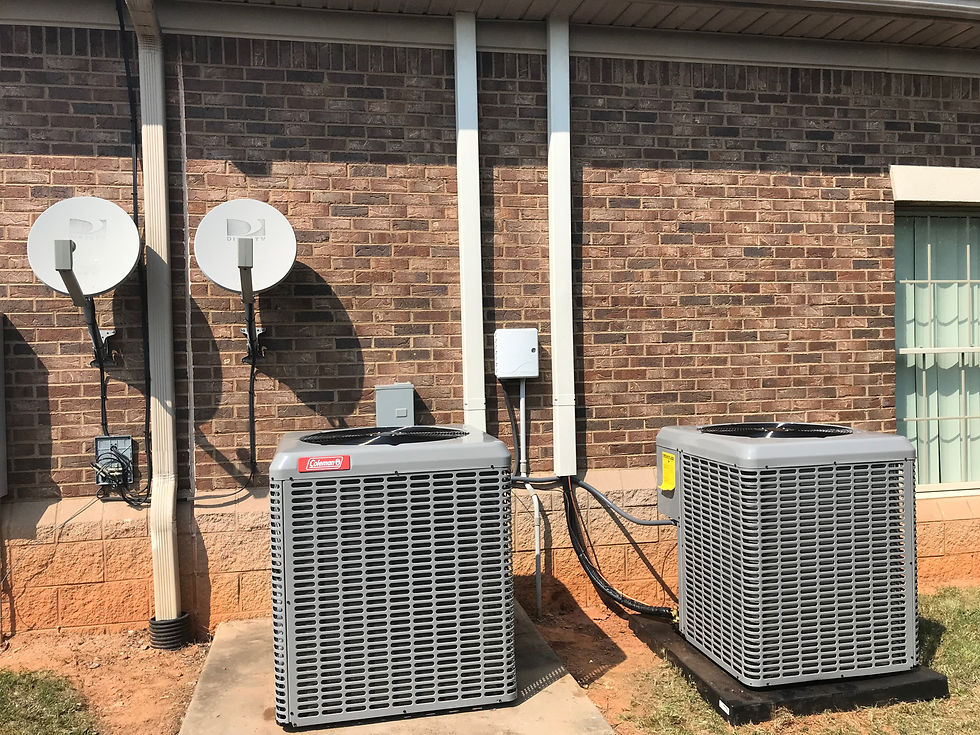 Eye-level view of a technician installing a new air conditioning unit outside a home