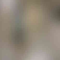 Guest bath with wainscoting and floral printwallpaper