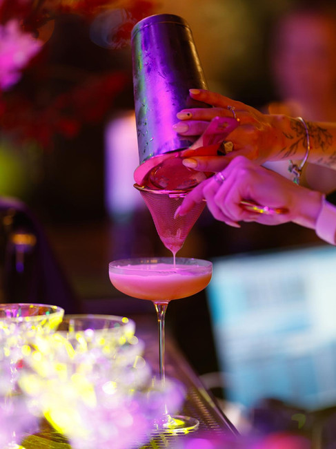 Close-up of a handcrafted signature cocktail at Hubble Bubble Lounge in Hallandale Beach.