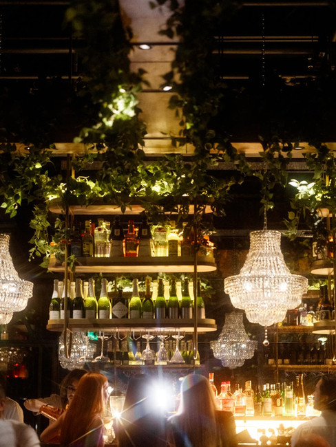 Evening atmosphere inside Hubble Bubble Lounge with elegant lighting in Hallandale Beach.