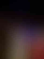 Lounge seating area with ambient lighting and guests at HB Lounge Bar