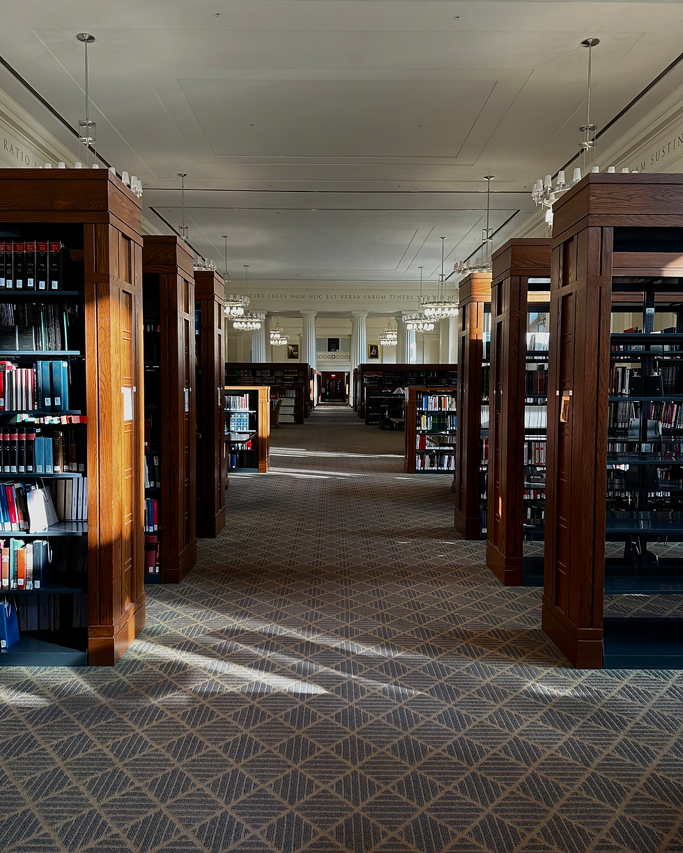 Inside of Harvard Law School Library with bookshelves