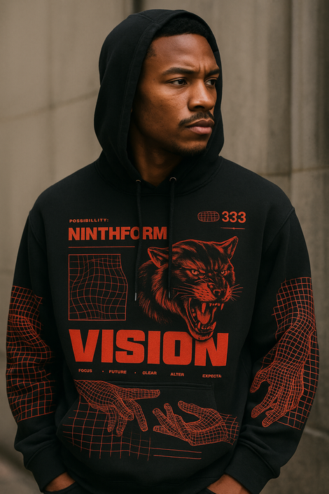 Male model wearing a black Ninthform hoodie with the red “Vision” graphic, styled in a moody streetwear photoshoot.