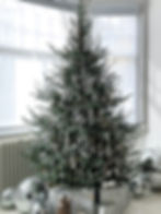 Minimalist Christmas tree styled with only icicle ornaments for a frosty look.