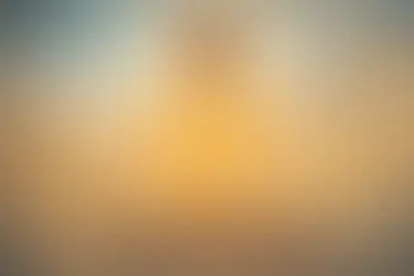 Woman surrounded by golden light, illuminated from within as she breathes.