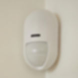A Yale PIR placed in the corner of a room