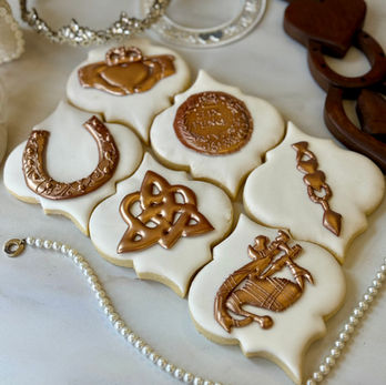mini horseshoe, six pence, bagpipes, Oathing stone, Welsh love spoon, Claddagh Ring