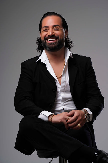 Smiling seated portrait, professional photo.