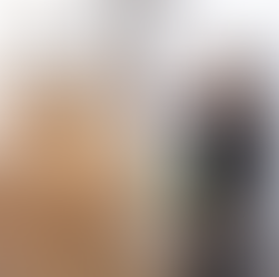 maternity photographer holding a dress getting ready for a photoshoot