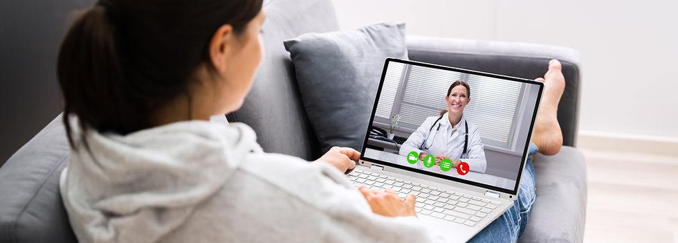 A pt using her computer and looking at her treating NP via Telemedicine