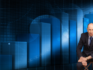 Dave Skipton sitting in front of a graph