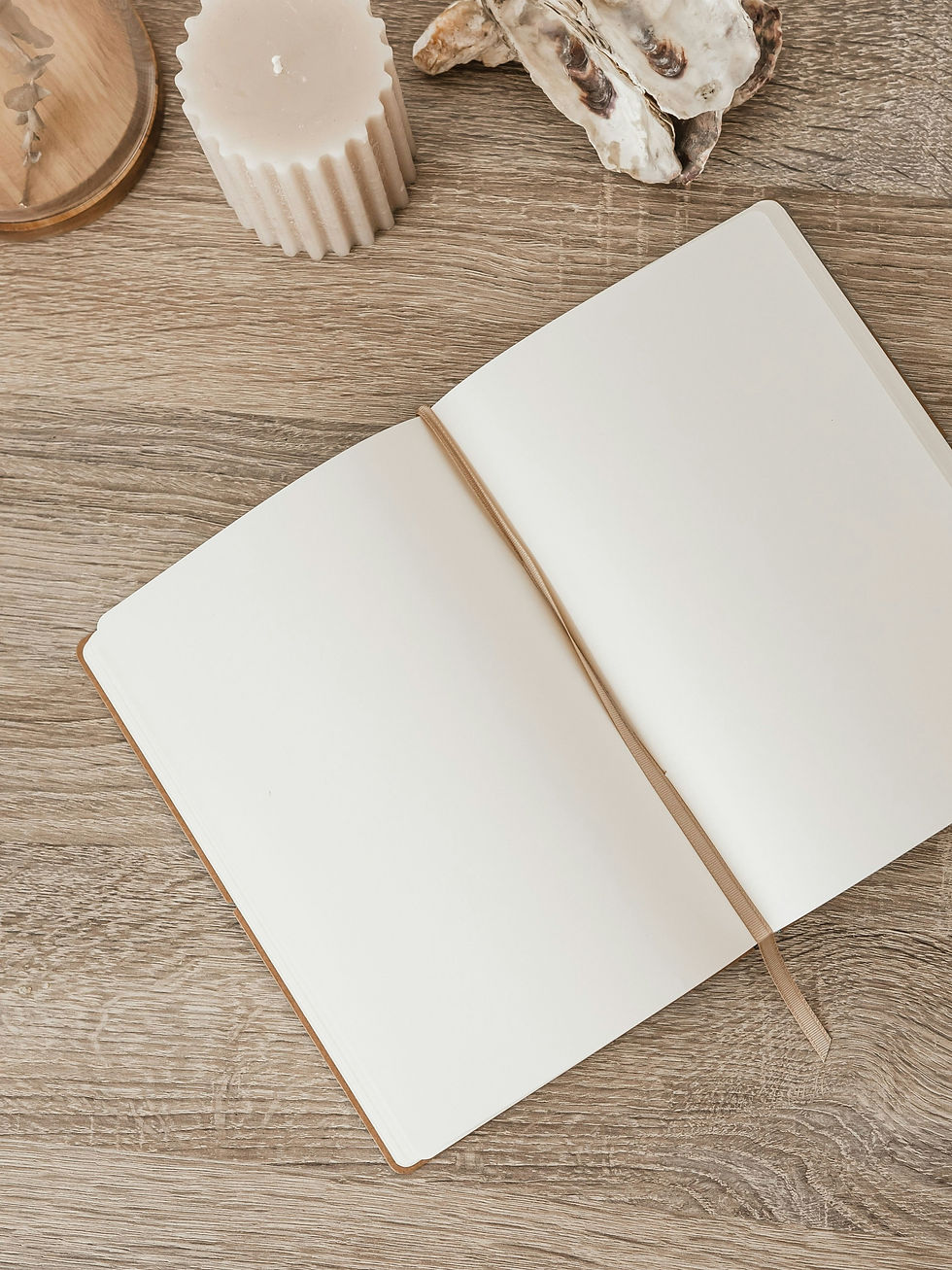 An open journal on a warm wooden surface for homebuying questions