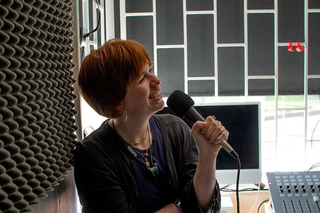 Future Artefacts FM co-host, Niamh Schmidtke is shown speaking into a mic, in the RTM reco