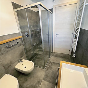 Elegant bathroom with glass shower, modern design and refined finishes