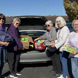 Dearborn County Retired Teachers Association members (L-R) Judy Hagadron, Janet Hart, Laura Rolf, Fayla Nanz, and Janet Hornback load up books, crayons, and other school supplies for Cincinnati Children’s Hospital and Medical Center patients in the Cardiac Unit and School Services Department as the group’s 2026 Community Service Project.