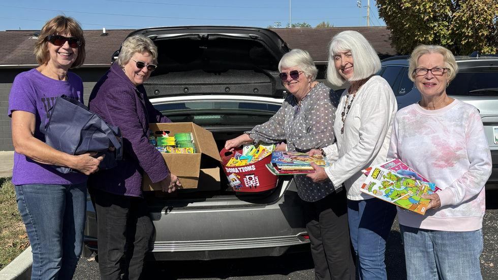 Dearborn County Retired Teachers Association members (L-R) Judy Hagadron, Janet Hart, Laura Rolf, Fayla Nanz, and Janet Hornback load up books, crayons, and other school supplies for Cincinnati Children’s Hospital and Medical Center patients in the Cardiac Unit and School Services Department as the group’s 2026 Community Service Project.