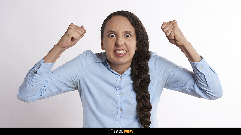 Angry woman clenching fists