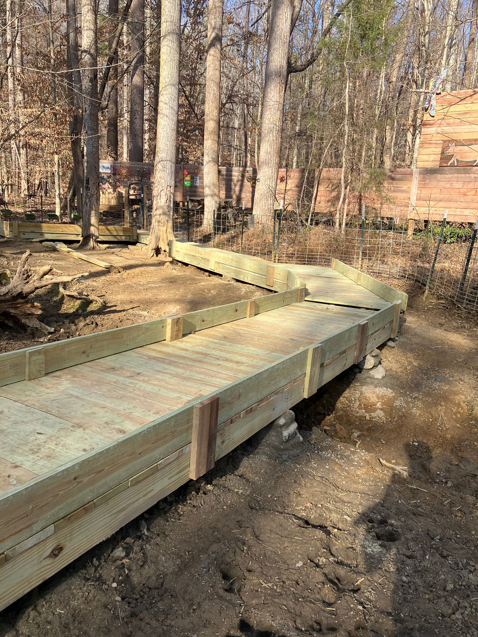Wooden boardwalk and floating deck for a farm near Carrboro, NC