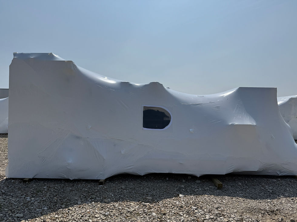 Close-up view of sealed industrial shrink wrap with ventilation vents on generator