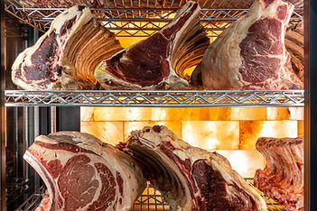 Beef steak in dry aged meat aging cabinet. Barbecue steak on fridge in delicious gourmet r