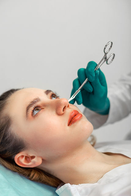 rhinoplasty-the-surgeon-hands-touches-the-patient-2025-01-08-20-36-51-utc.jpg