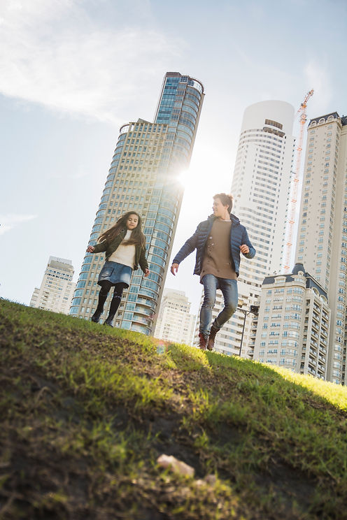 low-angle-view-father-daughter-walking-park.jpg