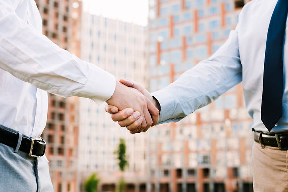 close-up-men-suit-making-agreement.jpg