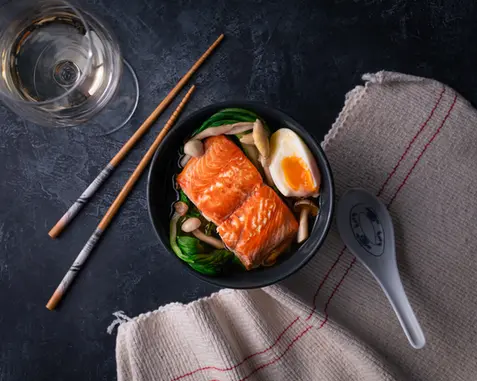 Professional food photography of a salmon ramen dish for Wild Fish Discovery. Commercial studio imagery with clean, modern styling by Patryk Majewski at Patryk Creative.