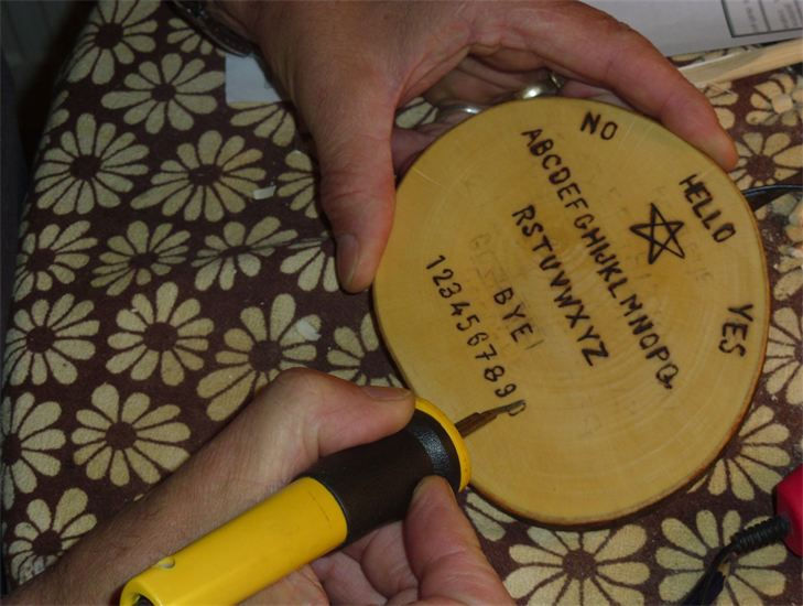 Pyrographing a ouija board