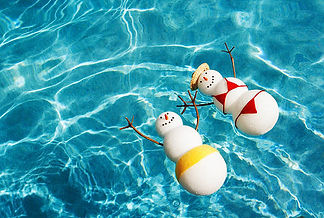 snowmen sunbathing in pool