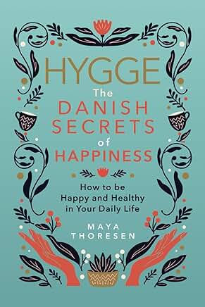 Book cover on teal with folk floral art, titled Hygge: The Danish Secrets of Happiness by Maya Thoresen, calm and cheerful.