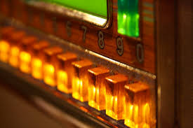 old fashioned juke box, golds and greens, push buttons