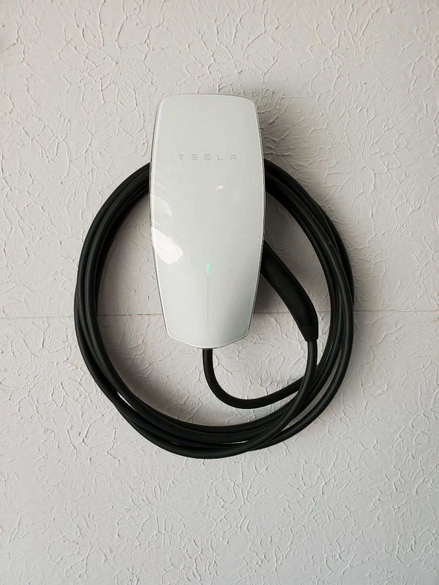 Wall mounted Electric Vehicle Charger, Tesla Brand Pictured