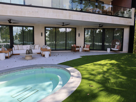 artificial grass backyard installation in Miami Florida with pool and modern landscaping