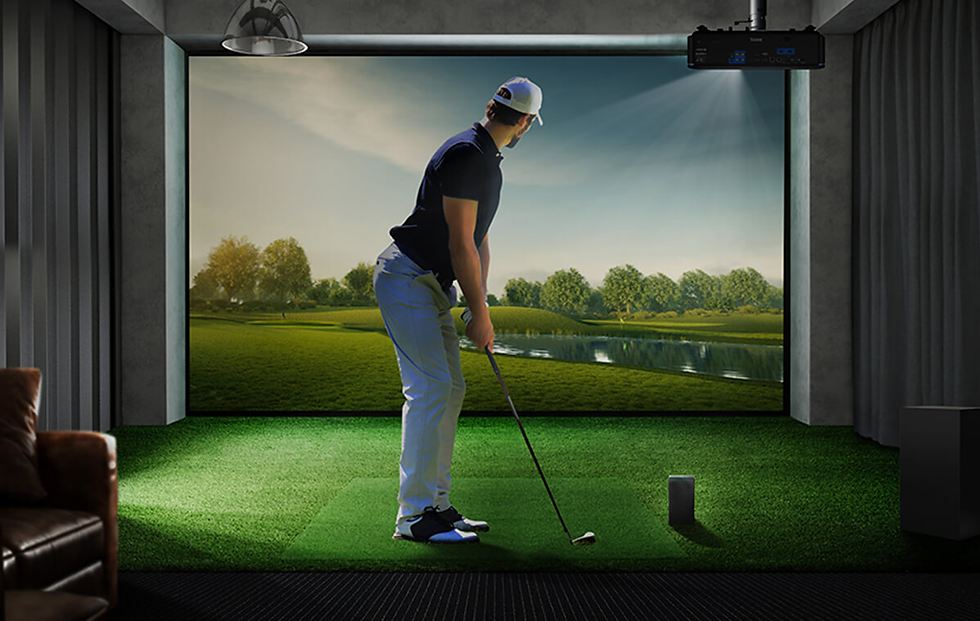 Man in golf attire swings a club in an indoor golf simulator. Green turf, realistic nature screen, and moody lighting set the scene.