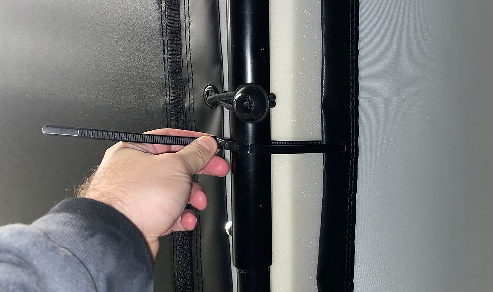 Man tightening  the bolts on the impact screen frame 