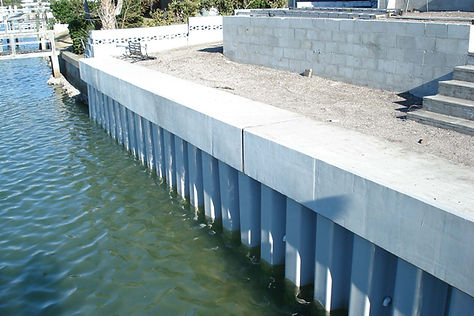 homeguide-vinyl-seawall-panels-with-concrete-cap.jpg