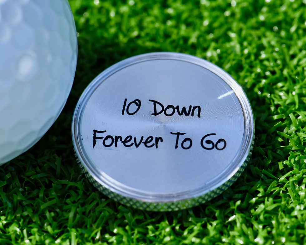 Engraved 10th anniversary golf ball marker with textured edge and heartfelt personal message engraved on back.