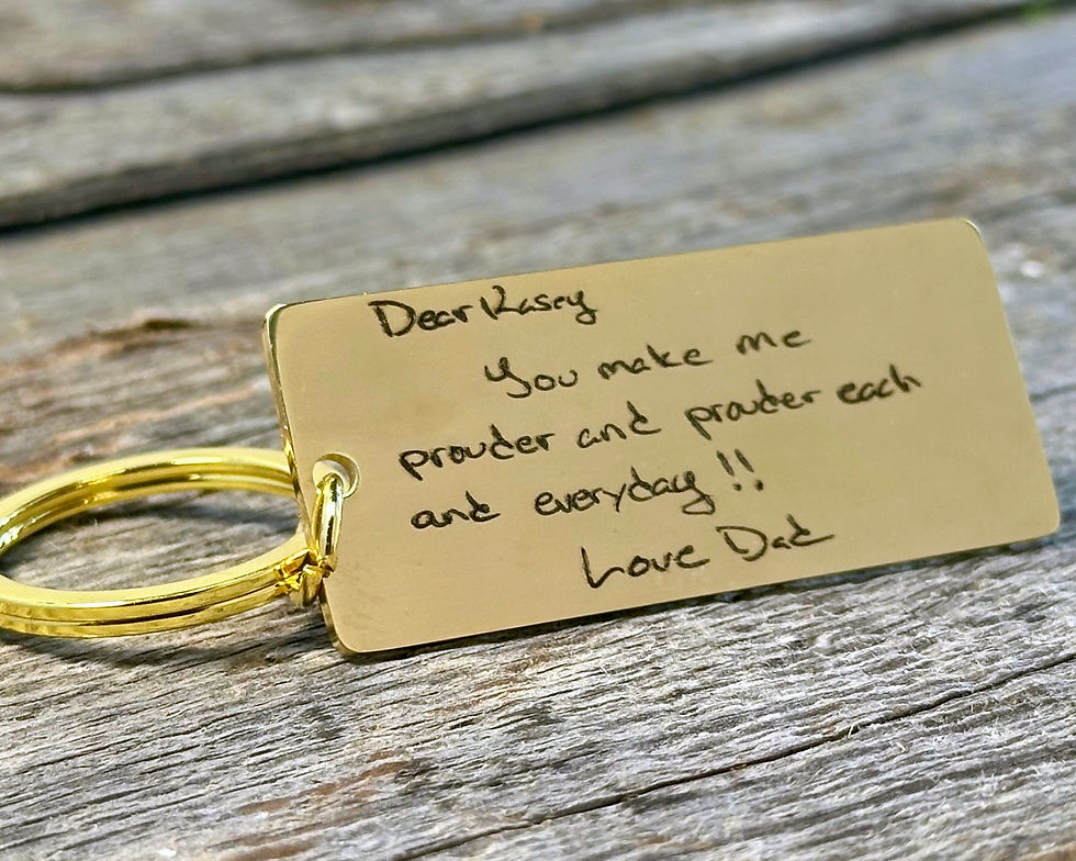Personalized stainless steel keychain engraved with a handwritten message, available in gold, silver, or rose gold.