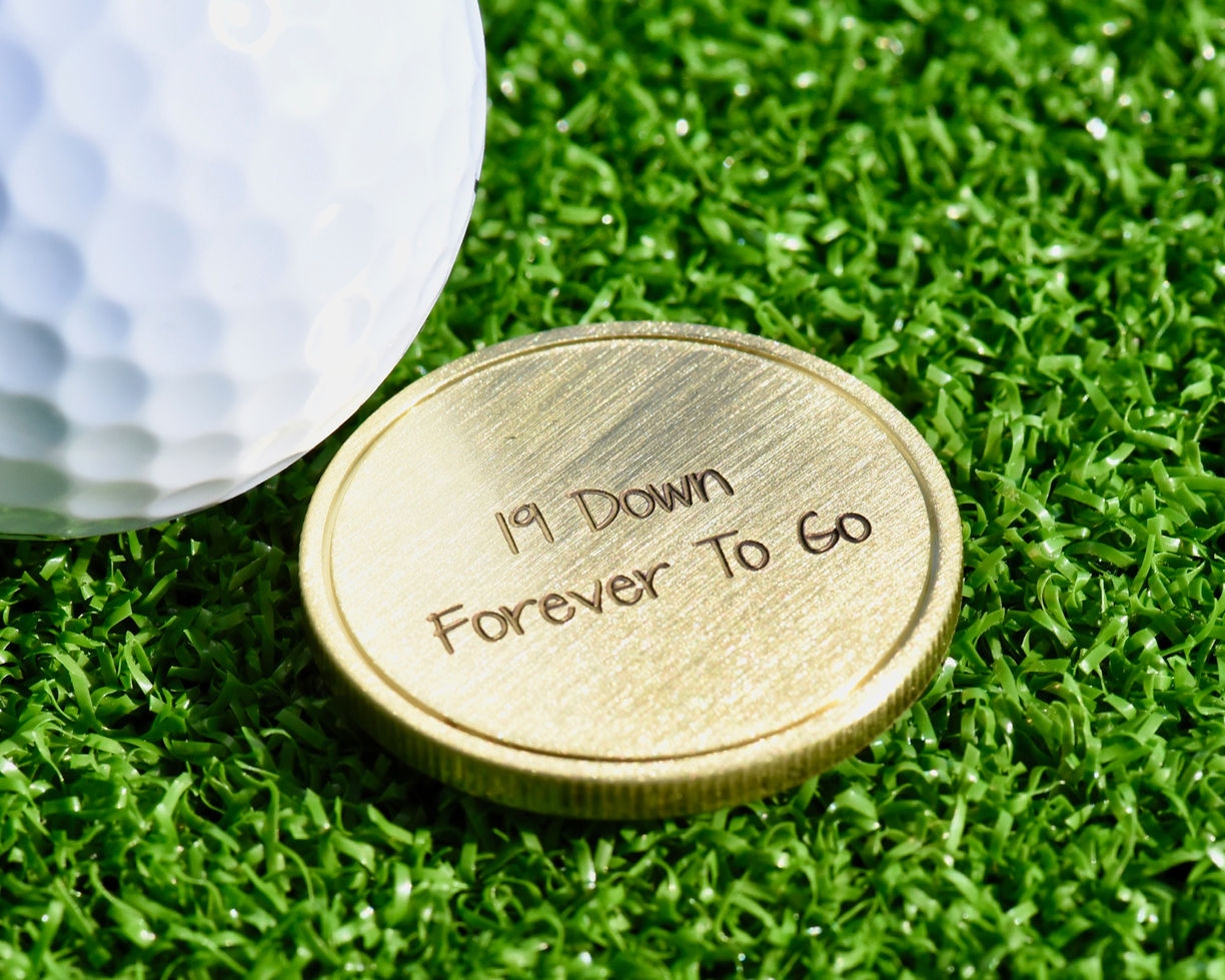 Bronze golf marker with personalized engraving on the reverse side for a special 19th anniversary gift.